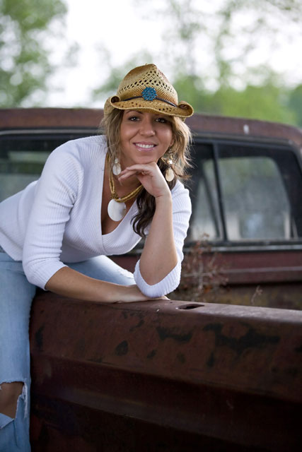 In her original song Summer Nights she sings of a rusty old Ford truck 