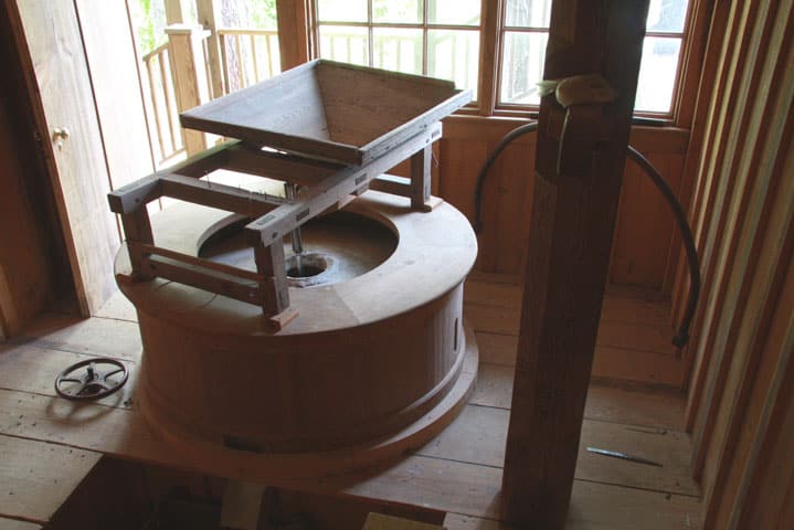 Stone-&-Hopper-lo-res-235 Grist stone at water powered mill in eastern NC near Greenville, North Carolina