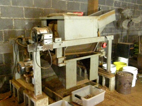 Pecan cracking machine at Martin Supply shells pecans for innkeeper at Big Mill Bed and Breakfast 