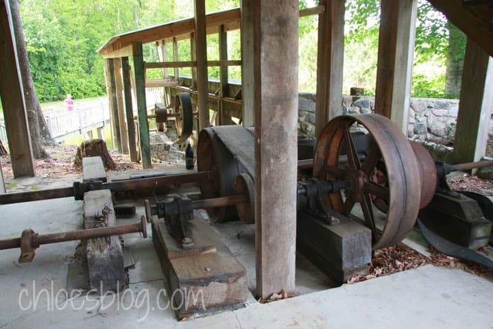 Old gears and pulleys of water powered grist mill 