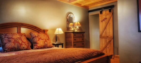 Photo of the Mule Room at Big Mill B&B. The Mule Room Suite is perfect for extended stay guests who want all the comforts of home - including a private and peaceful bedroom. 